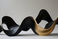 soft flowing forms in black and gold, continuously undulating and creating a visually dynamic scene
