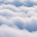 Soft, fluffy clouds form an undulating pattern across a blue sky. The image features Royalty Free Stock Photo