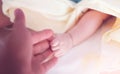 Soft focus of baby hands and mom, New family and baby protection concept, New Family And Baby Protection From Mom