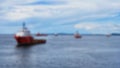 Soft focus background photo of marine offshore vessels at anchorage area