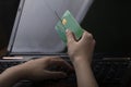 soft focus, bank card, hook. the child pays for the purchase using the card. scammers are trying to steal money from the card