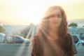 Soft Focus blurry portrait of cute woman in sunset sunrays
