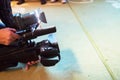 Soft focus and blurry of Professional cameraman and Video camera operator working with his professional equipment Royalty Free Stock Photo