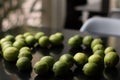 Soft focus of a bunch of fresh key limes on a table Royalty Free Stock Photo