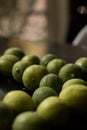 Soft focus of a bunch of fresh key limes on a table Royalty Free Stock Photo