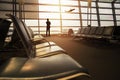 Soft Focus of Businessman in his Business Trip looking at Airplane Boarding in Airport Departures gate Terminal through