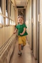 Soft focus child kid boy cheerfully run in train carriage. Travel and children leisure concept passenger at railway