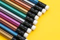 Soft focus on colorful pencil with eraser on solid yellow background with copy space using as writing, mistake and correction or Royalty Free Stock Photo