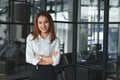 Soft focus of confident Asian businesswoman standing in office. Leader business woman concept. Royalty Free Stock Photo