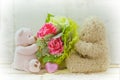 Soft focus couple of cute bears holding roses bouquet