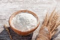 Soft focus, flour in a wooden bowl, ears of wheat, barley, cooking, bread, and cookies arranged on a wooden tabletop in a rustic Royalty Free Stock Photo