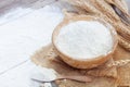 Soft focus, flour in a wooden bowl, ears of wheat, barley, cooking, bread, and cookies arranged on a wooden tabletop in a rustic Royalty Free Stock Photo