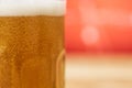 Soft focus of a glass of a foamy craft beer with blurry background