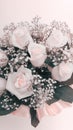 Soft focus gypsophila and rose flower bouquet. Wedding vertical beige pink background Royalty Free Stock Photo