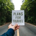 Soft focus hand holds paper, symbolizing plans for travel Royalty Free Stock Photo