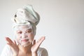 Soft focus on Happy Asian young woman with a sheet mask on her face. Royalty Free Stock Photo