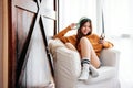 Soft Focus of Happy Young Woman Relaxing by Music Headphone from Smartphone on Sofa in Cozy House Royalty Free Stock Photo