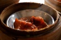 Soft focus hot close up red sauce spare ribs pork in bamboo basket in Chinese dim sum set Royalty Free Stock Photo