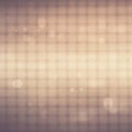 A soft-focus image featuring a grid pattern with a warm, sepia-toned hue. Light bokeh Royalty Free Stock Photo