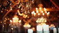 Soft focus image of sparkling crystal chandeliers adorning the ceiling in a rustic barn adding a touch of glamour to the Royalty Free Stock Photo