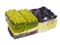 Soft focus of matcha green tea cake on blurred blueberry cheesecake Royalty Free Stock Photo