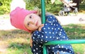 Soft focus meditative little preschooler girl in the park on  swing resting Royalty Free Stock Photo