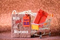 Soft focus mini shopping cart and shopping bags with label tags