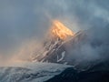 Soft focus. Minimalist mountain landscape with fiery snow peak. Wonderful minimalist landscape with big snowy mountain peaks above