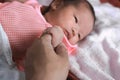 Soft focus of newborn tiny baby hand on parent Royalty Free Stock Photo