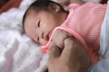 Soft focus of newborn tiny baby hand on parent Royalty Free Stock Photo