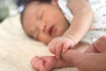 Soft focus of newborn tiny baby hands holding parent hands Royalty Free Stock Photo