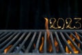 Soft focus photo of an empty barbeque grill, 2023 written with fireworks Royalty Free Stock Photo