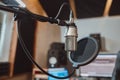 Soft focus on professional microphone in the workplace for broadcasting. Music rehearsal space. Sound recording studio Royalty Free Stock Photo