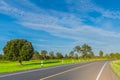 The soft focus of the road,green paddy rice field with the beautiful sky and cloud in the afternoon Thailand, the beam, light, an