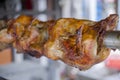 Soft focus Rotating spit roast chicken on an open charcoal fire Royalty Free Stock Photo