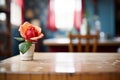 soft focus on a single red rose on a table in the foreground Royalty Free Stock Photo