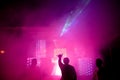 Soft focus, smoke at a night disco, vibrant stage, neon lights and beams of light at the Club Phaselis Rose Hotel in Kemer, direct