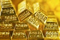 Soft focus of stacking gold bars with the golden reflect light.