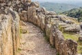 Soft focus stone ruins corridor path way between small narrow walls, abandoned ancient antique city world heritage touristic