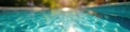 Soft focus, sun dappled pool water, hazy background, escape, summertime Royalty Free Stock Photo