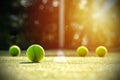 Tennis balls on grass court with sunlight Royalty Free Stock Photo