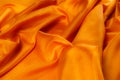 Soft focus. texture golden-red silk fabric. Bright, bold and noisy, this is perfect for this extroverted personality A wise man