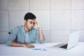 Soft Focus of Tired and Stress Young Businessman Sitting on Desk in Office with Computer Laptop Royalty Free Stock Photo