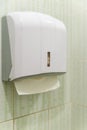 Soft focus tissues paper towel dispenser on granite wall in barthroom Royalty Free Stock Photo