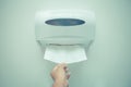 Soft focus tissues paper towel dispenser on wall in barthroom. Royalty Free Stock Photo