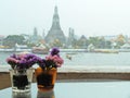 Soft Focus Two Vases of Flowers with Temple of Dawn in Background Royalty Free Stock Photo