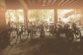 Soft focus,Vintage rusted bicycle Under house with sunset