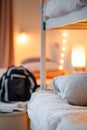 Soft-focus warm lighting creates a cozy atmosphere in a shared hostel dormitory filled with multiple bunk beds, travel Royalty Free Stock Photo