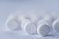 Soft focus white pills, aspirin on white background. Royalty Free Stock Photo