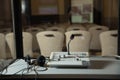 Soft focus of wireless Conference microphones and notebook in a meeting room. translators cubicle . interpreting - Microphone and